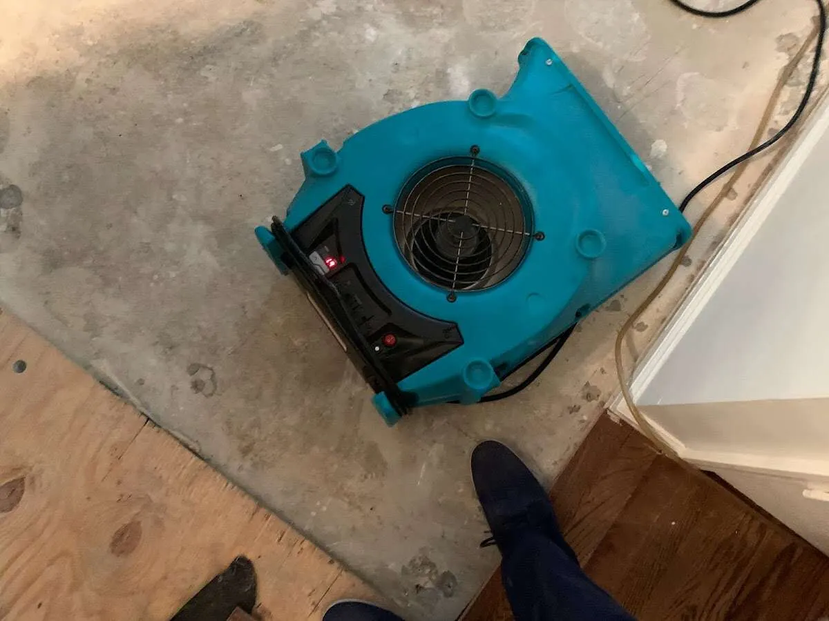 Air mover drying subfloor during Commercial Water Damage Restoration in Coto de Caza